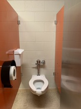 A toilet in the girls locker room bathroom showing exemplary standards. 
