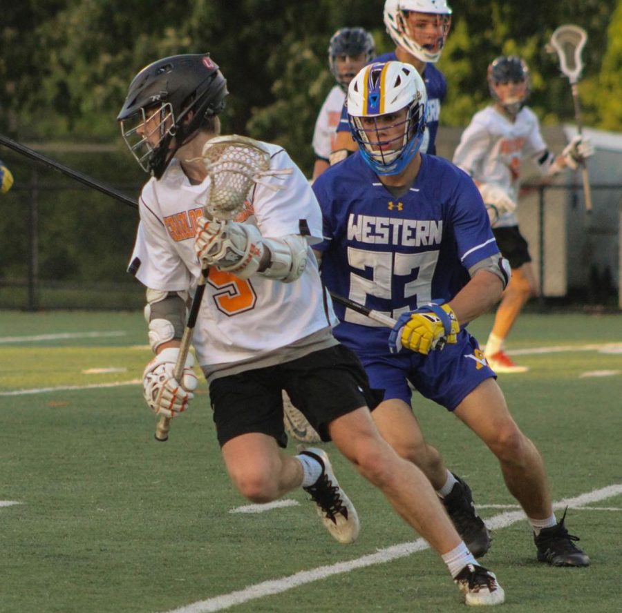 Senior Brendan Riley beats a Western defender during the 2019 lacrosse season.