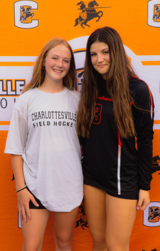 Sophomores Lulu Jennings (field hockey player) and Lea Bricker (volleyball player) at the beginning of the year pep rally