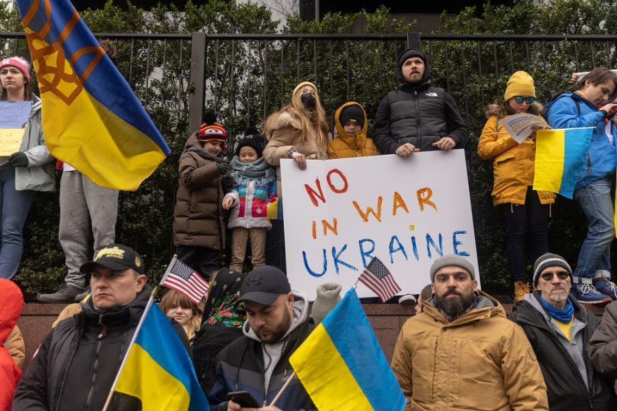 People take part in a protest against Russia's massive military operation in Ukraine, outside the United Nations headquarters in New York City, U.S., February 24, 2022. REUTERS/Jeenah Moon