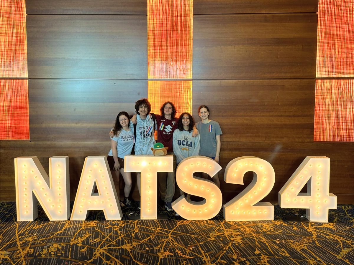 CHS debaters posing with the Nats '24 sign. Left to right: Rose Brennan-Wilkinson, Solly Schwartzman, Gabe Damiani, Nava Khurgel, Lily Curtis.