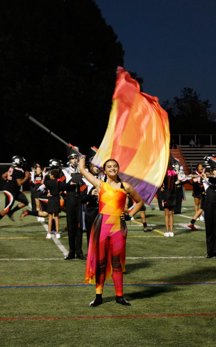 Marching Knights and CHS Color guard preforming at a football game. Shown: Anna Ryall